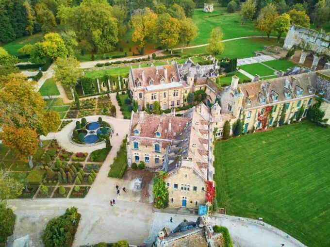 scenic aerial view of abbaye des vaux de cernay, a cistercian monastery in northern france